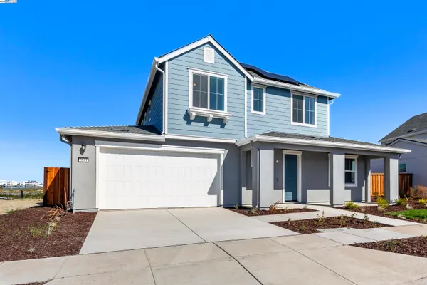 a front view of a house with yard