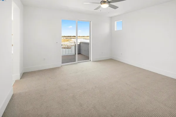 an empty room with a kitchen