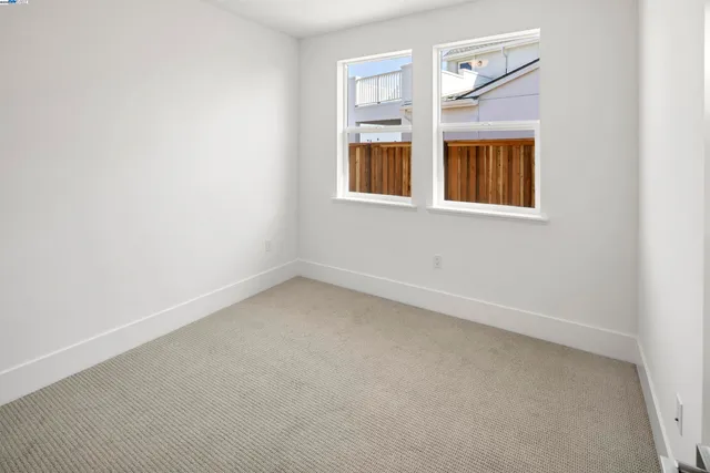 a view of empty room with windows