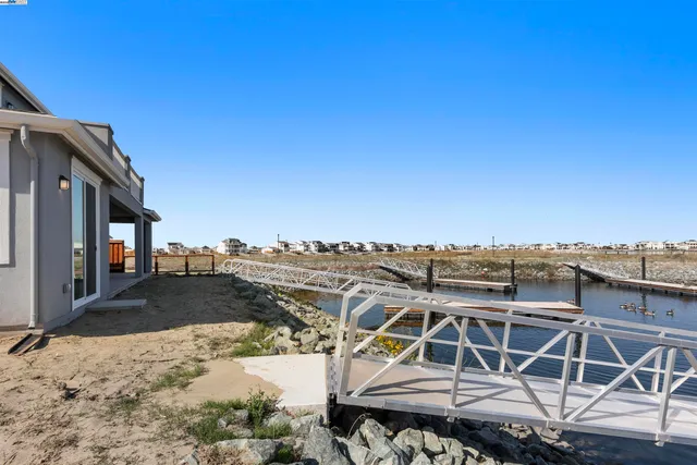 a view of a balcony with wooden floor and city view