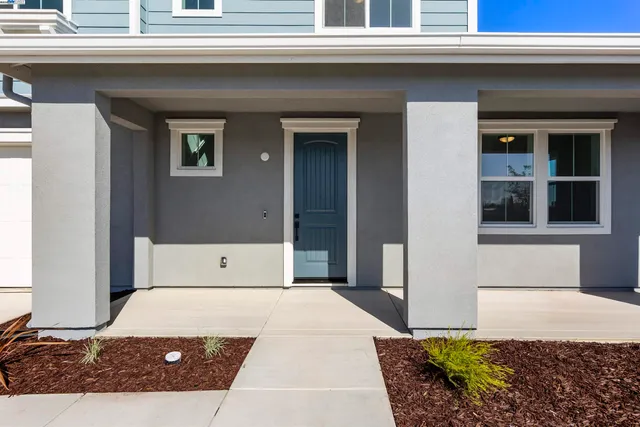 a view of a bedroom with a bed and a window
