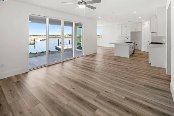a view of a living room kitchen and a wooden floor