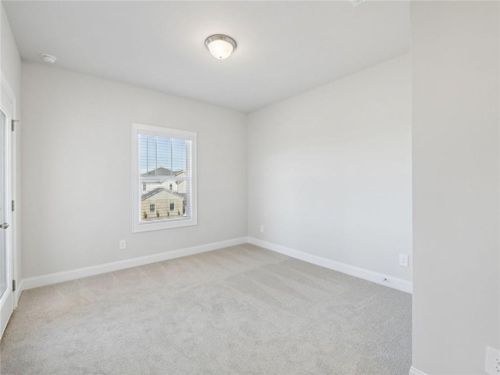 1291 Whitman Circle Monroe, GA 30656 - Photo 13 of 22 an empty room with windows