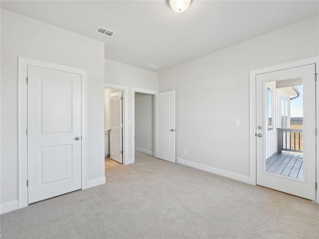 1291 Whitman Circle Monroe, GA 30656 - Photo 14 of 22 a view of an empty room and a gallery