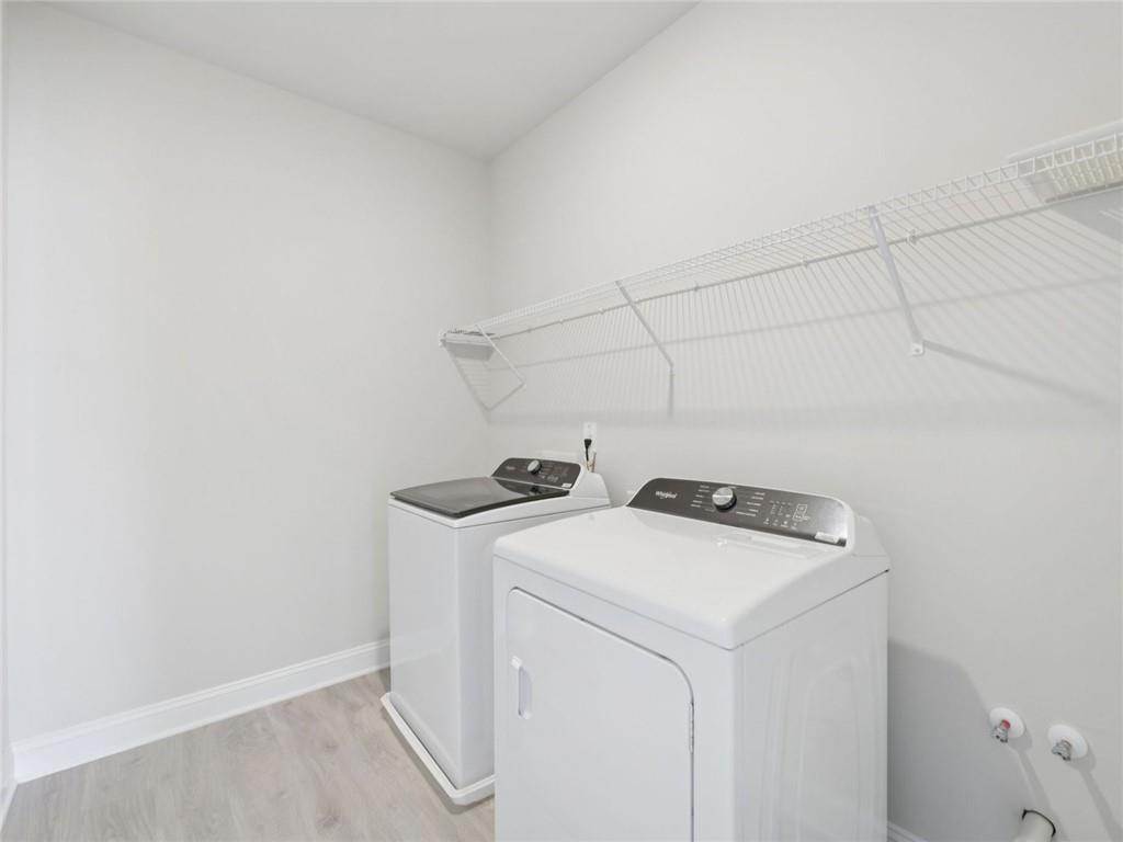 1291 Whitman Circle Monroe, GA 30656 - Photo 20 of 22 a utility room with dryer and washer