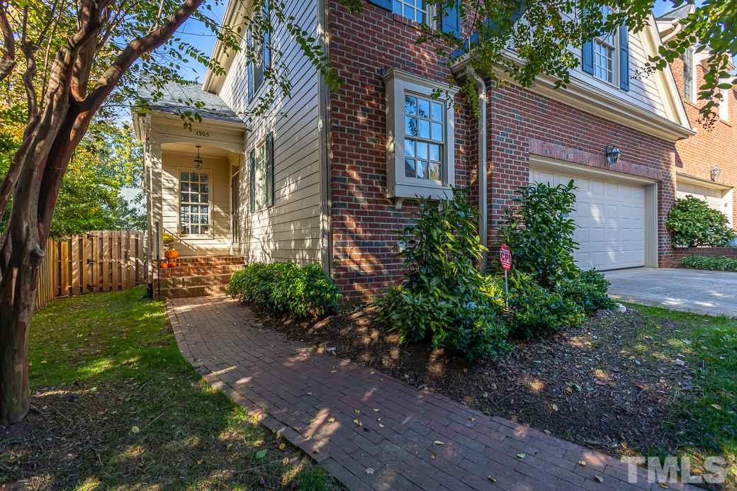 1305 Canfield Court Raleigh, NC 27608 - Photo 1 of 30 a front view of a house with garden
