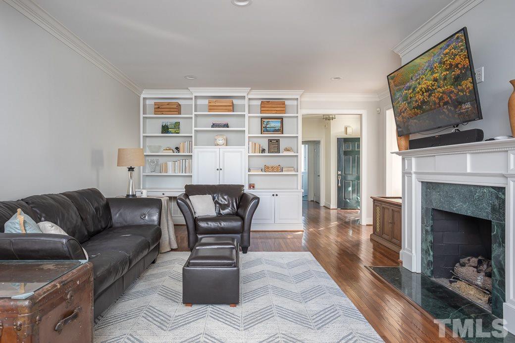 1305 Canfield Court Raleigh, NC 27608 - Photo 13 of 30 a living room with furniture and a fireplace