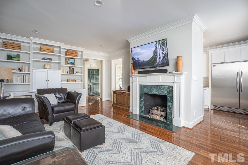 1305 Canfield Court Raleigh, NC 27608 - Photo 14 of 30 a living room with furniture and a fireplace