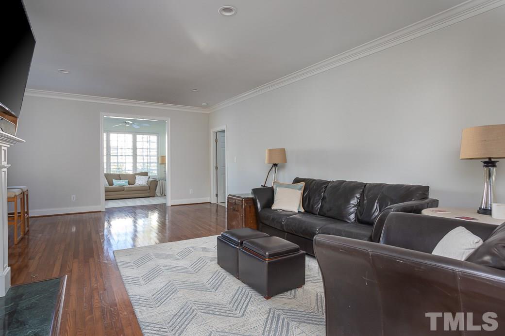 1305 Canfield Court Raleigh, NC 27608 - Photo 17 of 30 a living room with furniture and a flat screen tv