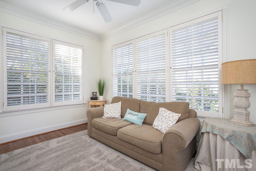 1305 Canfield Court Raleigh, NC 27608 - Photo 18 of 30 a living room with furniture and a large window