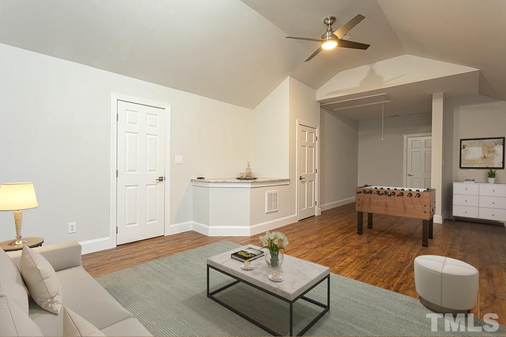 1305 Canfield Court Raleigh, NC 27608 - Photo 24 of 30 a living room with furniture and a table