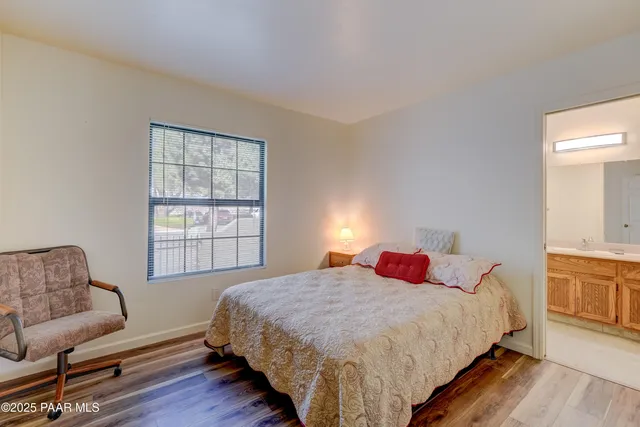 a kitchen with granite countertop a sink stove and cabinets