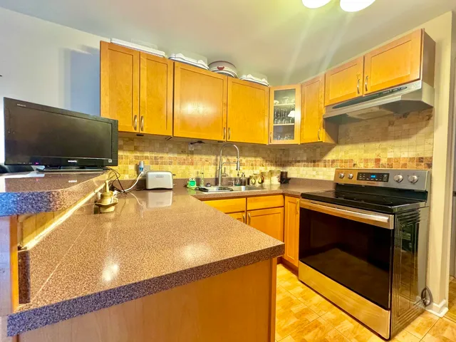a living room with fireplace furniture and a flat screen tv