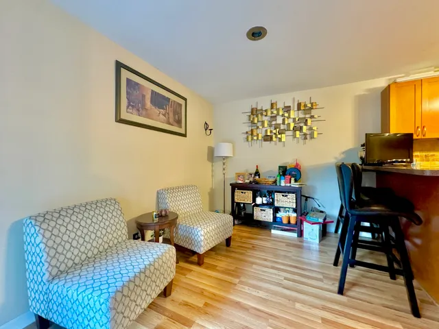 a bathroom with a sink and mirror with toilet