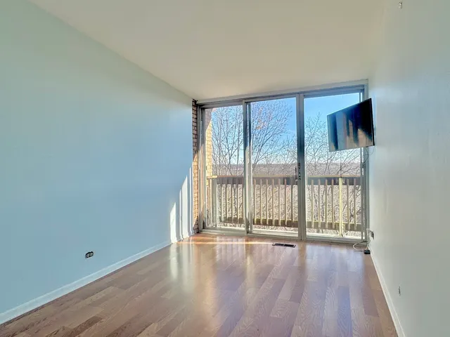 a view of a trees from a balcony