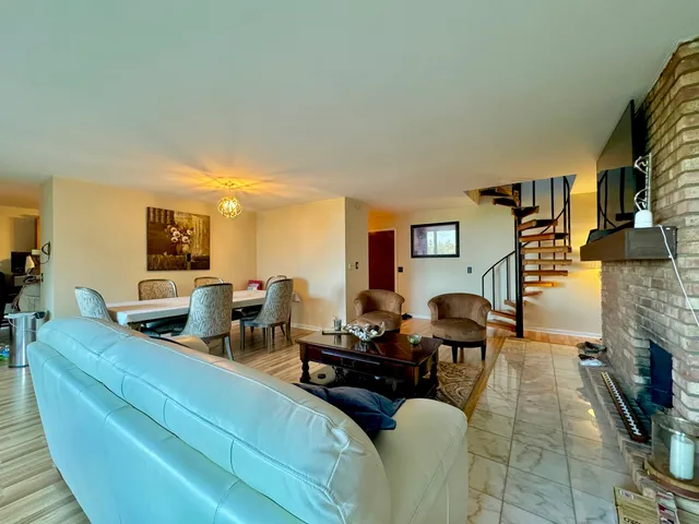 a living room with a flat screen tv and a fireplace