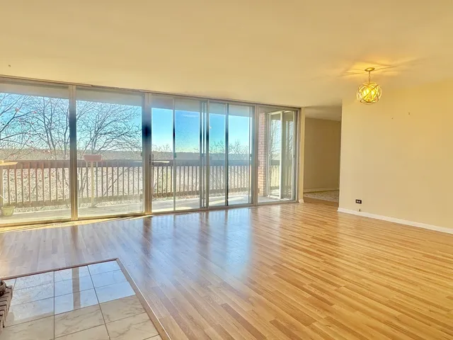 a living room with a fireplace furniture and a flat screen tv