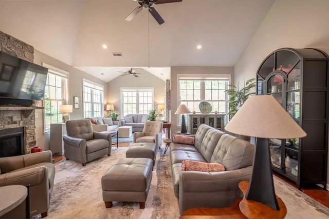 a living room with furniture and a fireplace