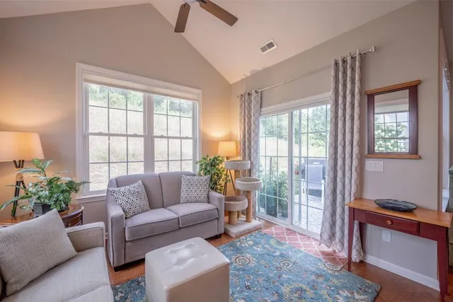 a living room with furniture and a window