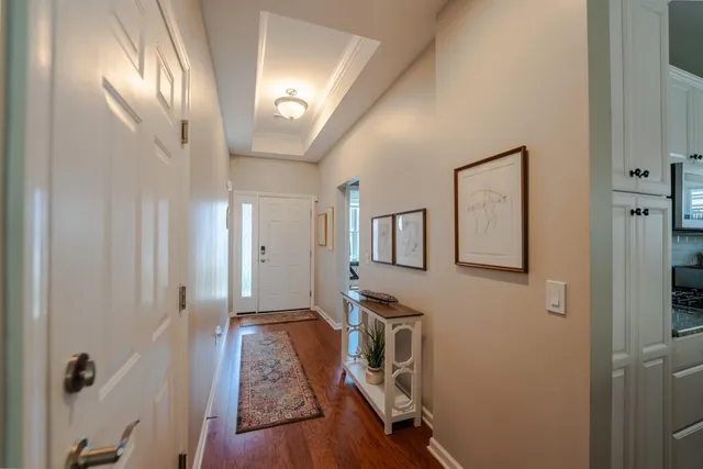 a view of a hallway with front door