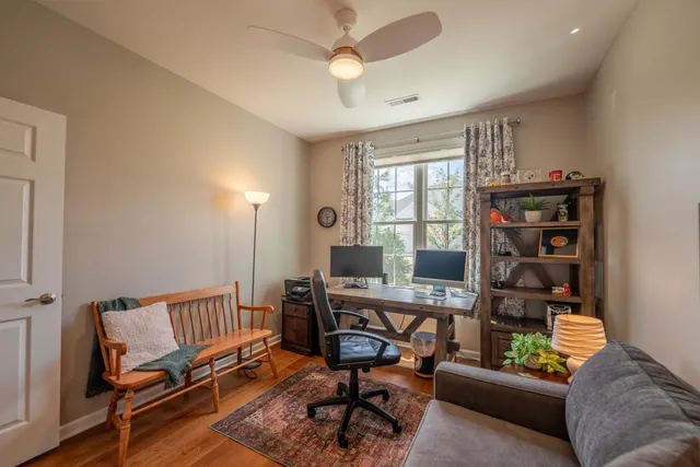 a reading room with furniture and a window