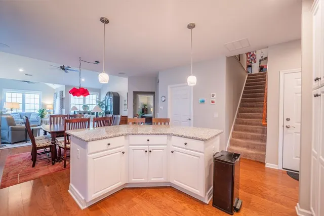 a very nice looking room with lots of furniture and wooden floor