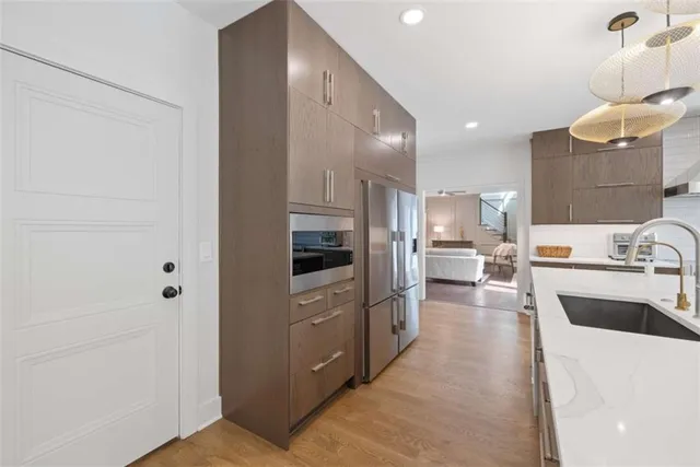 a bathroom with a granite countertop tub shower and a sink