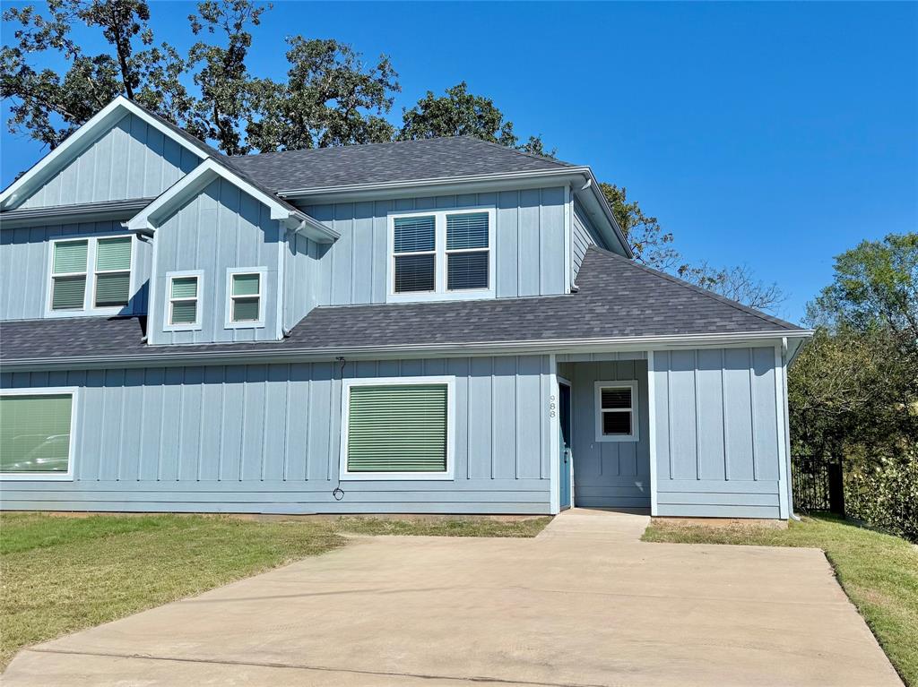 a house that has a large window in front of it