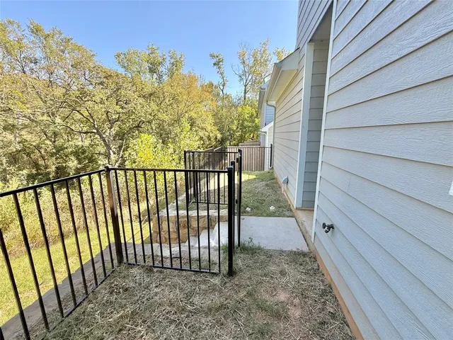 a view of a balcony with a pot