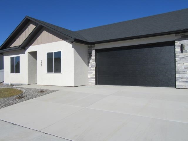 2468 Revere Road Grand Junction, CO 81505 - Photo 1 of 26 a front view of a house with a yard