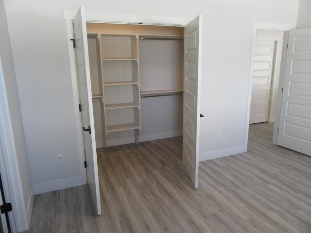 2468 Revere Road Grand Junction, CO 81505 - Photo 11 of 26 a view of an empty room with wooden floor