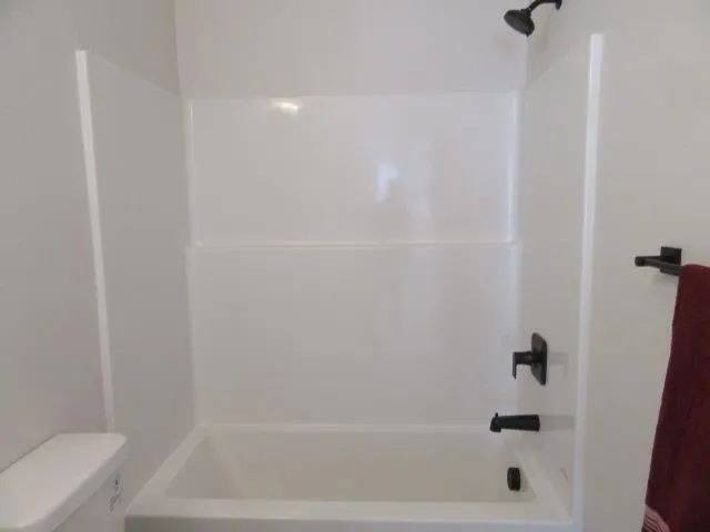 a close up of a bathtub curtain