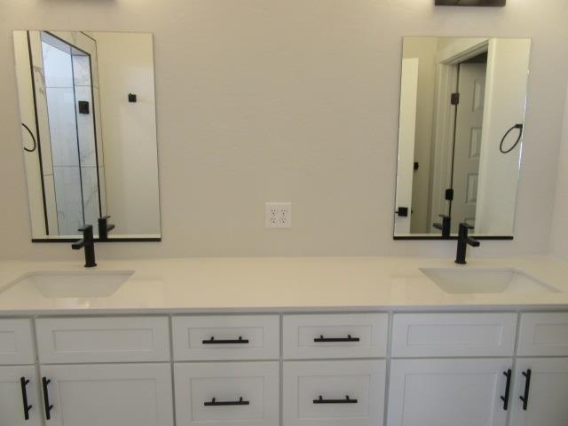 2468 Revere Road Grand Junction, CO 81505 - Photo 9 of 26 a bathroom with a sink and a mirror