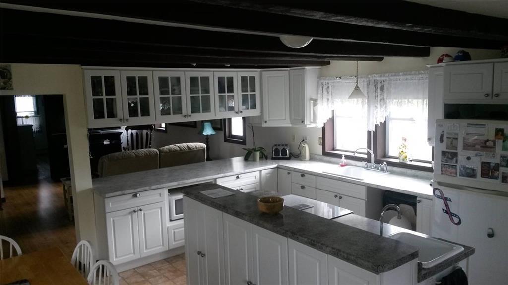 24 South Road South China, ME 04358 - Photo 10 of 27 GLASS CABINET DOORS BETWEEN KITCHEN...