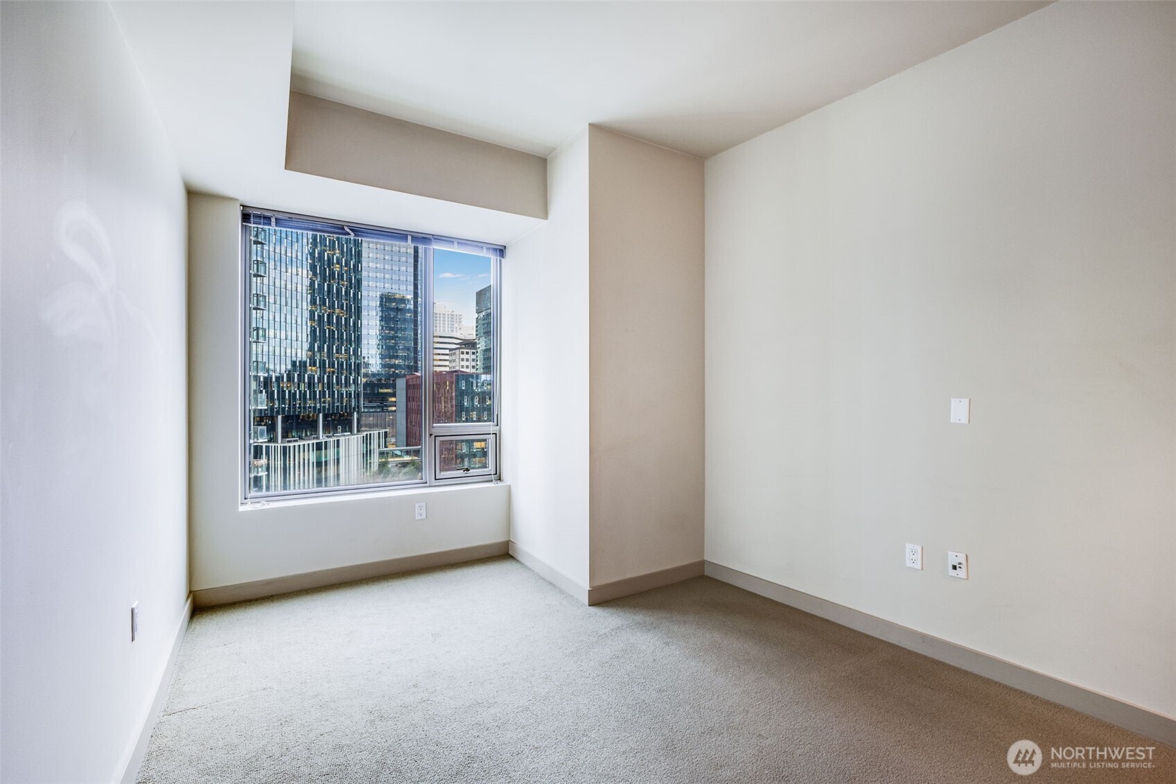 900 Lenora Street, Unit W803 Seattle, WA 98121 - Photo 11 of 29 an empty room with windows