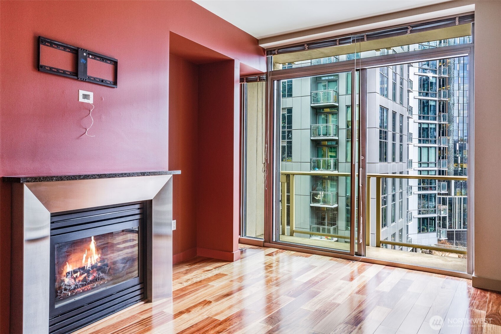 900 Lenora Street, Unit W803 Seattle, WA 98121 - Photo 5 of 29 a view of an empty room with a fireplace and a window