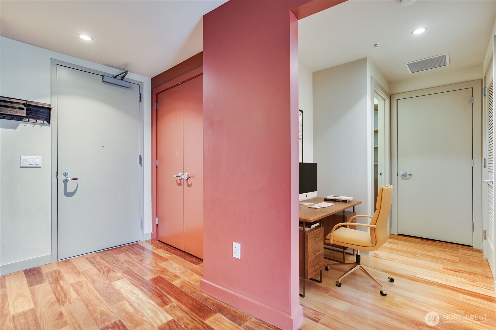900 Lenora Street, Unit W803 Seattle, WA 98121 - Photo 10 of 29 a view of a workspace with wooden floor and bathroom