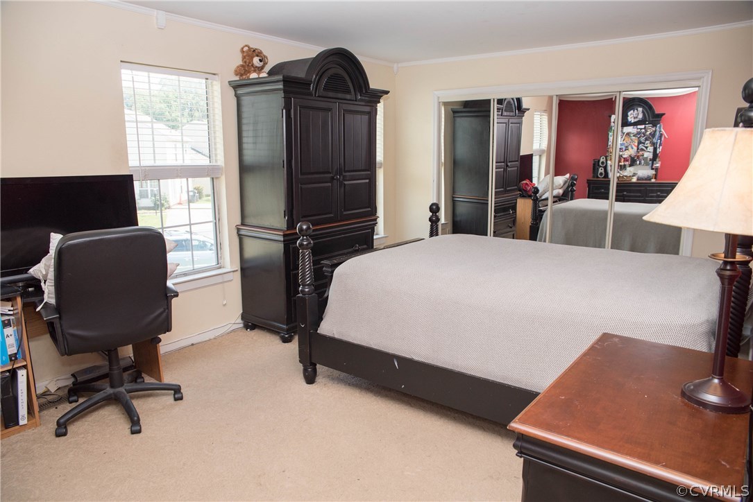 3200 Ransom Hills Road Richmond, VA 23237 - Photo 18 of 20 a bedroom with a bed and a desk