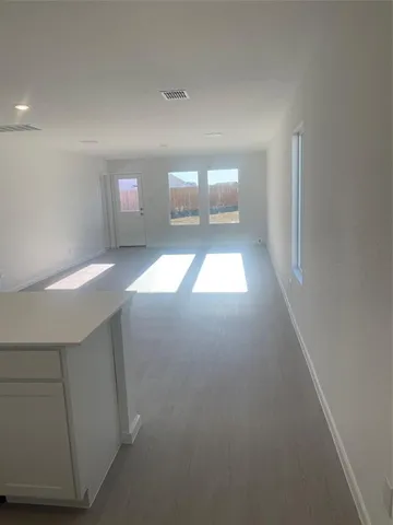 a view of empty room with windows