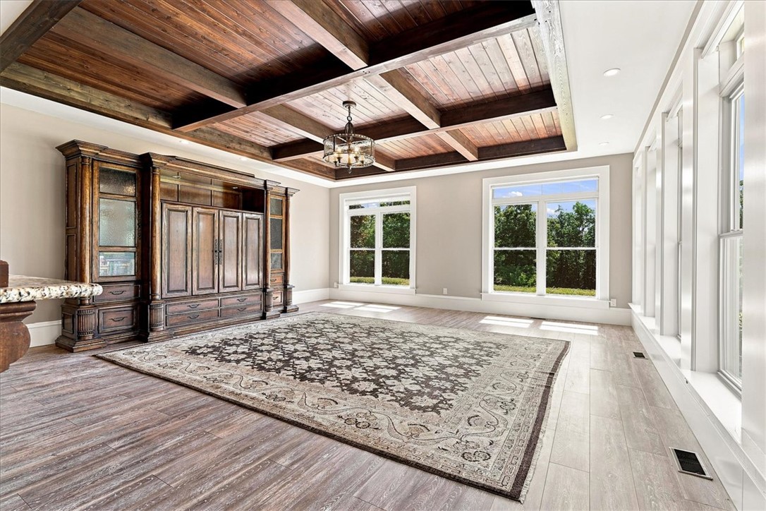 181 Sentell Road Williamston, SC 29697 - Photo 20 of 46 Open beam ceiling and 2 walls of tall windows complete this living space.