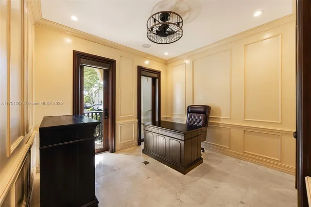 a view of a hallway with furniture and windows
