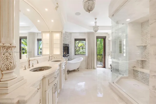 a spacious bathroom with a granite countertop tub sink and mirror