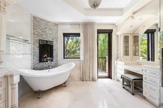 a spacious bathroom with a bathtub and sink
