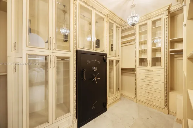 front view of a bathroom with a shower and a mirror