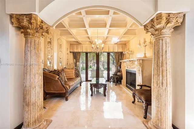 a very nice looking room with a large window and chandelier