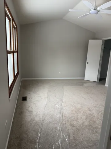 a bathroom with a double vanity sink a toilet and shower