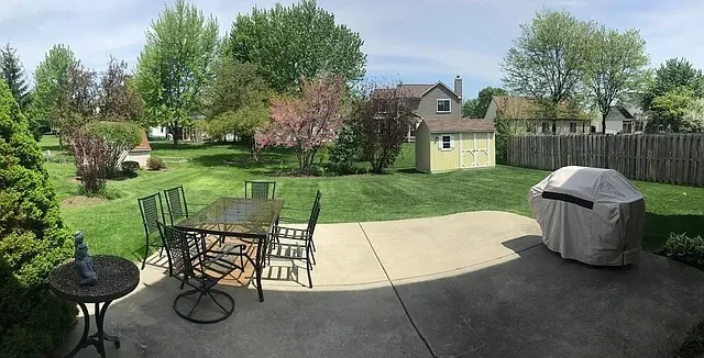 a view of a chair and table in the garden