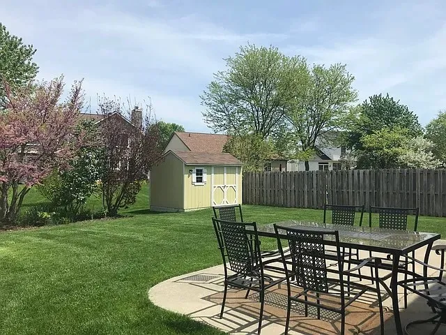 a view of a house with backyard porch and sitting area