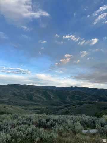 73 North River View Road, Unit 73 Huntsville, UT 84317 - Photo 10 of 21 Expansive mountain landscape with rolling, tree-covered hills under a partially cloudy sky