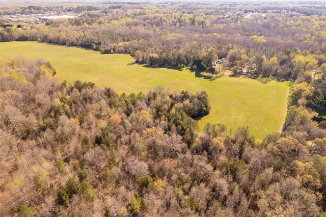 a view of residential houses with swimming pool